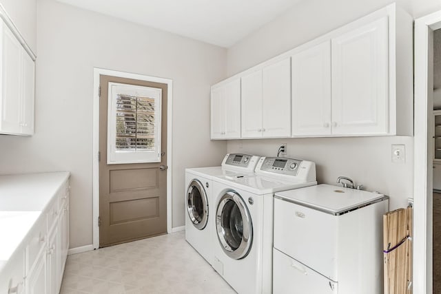 5411 Southwood Dr, Bloomington, MN 55437 - clothes washing area featuring light floors, cabinet space, baseboards, and washer and dryer