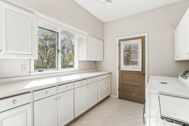 5411 Southwood Dr, Bloomington, MN 55437 - laundry room featuring light floors, cabinet space, and washing machine and clothes dryer