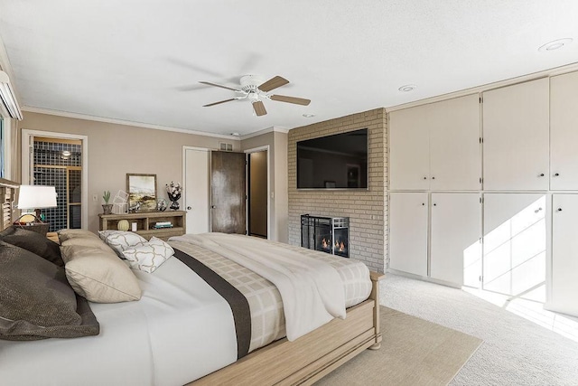 5411 Southwood Dr, Bloomington, MN 55437 - bedroom featuring a fireplace, ornamental molding, light carpet, and ceiling fan