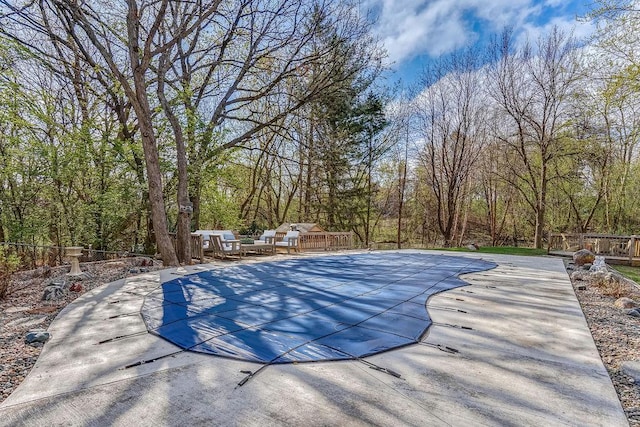5411 Southwood Dr, Bloomington, MN 55437 - view of swimming pool with a patio, fence, and a covered pool