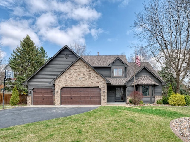 view of front facade featuring fence, a shingled roof, driveway, a front yard, and a garage