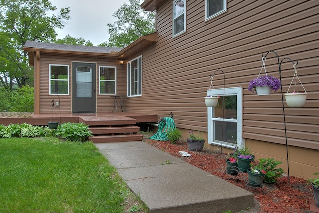 895 334th Ave NE, Cambridge, MN 55008 - view of exterior entry featuring a deck and a lawn