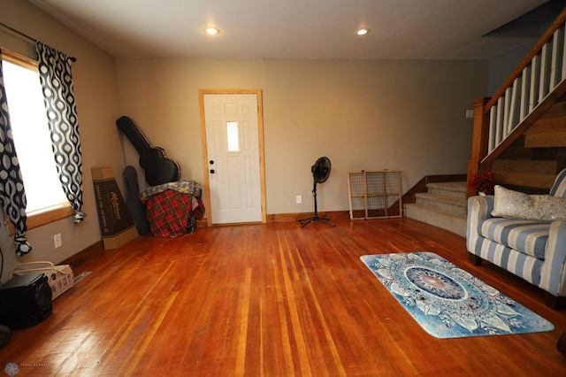 living room with stairway, baseboards, wood finished floors, and recessed lighting