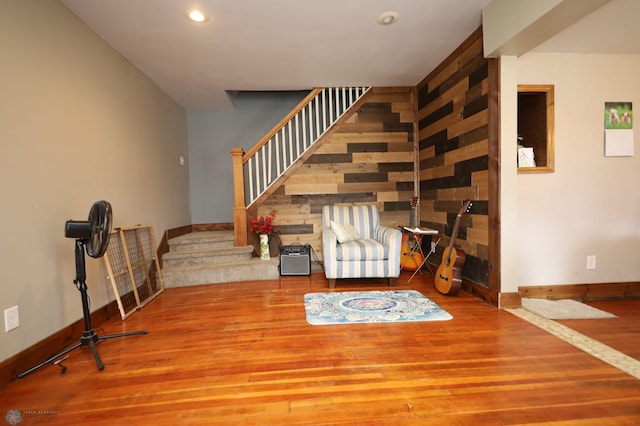 interior space featuring wood finished floors, baseboards, recessed lighting, and stairway