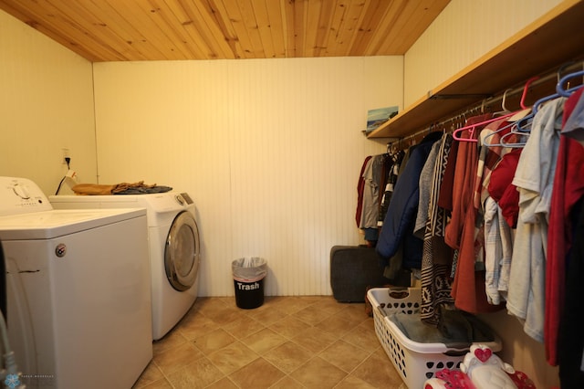 laundry room featuring wooden ceiling, washer and dryer, and laundry area