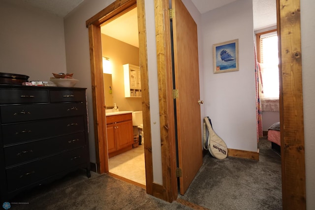 hallway featuring carpet