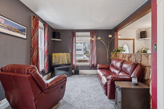 living room with baseboards and carpet
