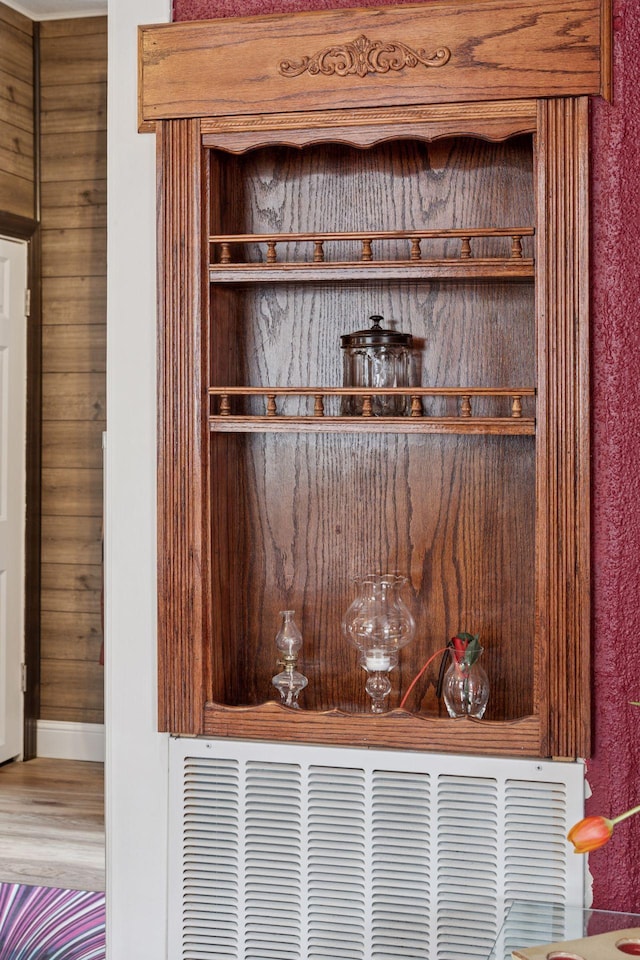 room details featuring baseboards and wood finished floors