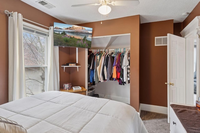bedroom featuring baseboards, a closet, carpet flooring, and visible vents