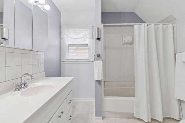 full bathroom with tile patterned flooring, vanity, baseboards, decorative backsplash, and shower / tub combo