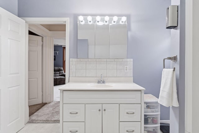 bathroom with vanity, tile patterned floors, and backsplash