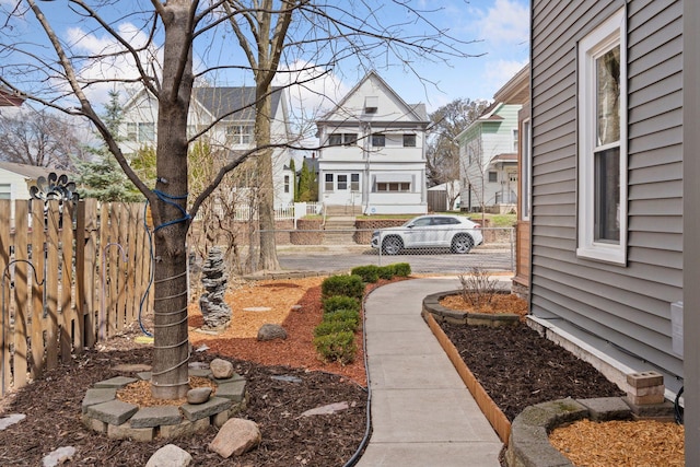 view of yard with fence and a residential view