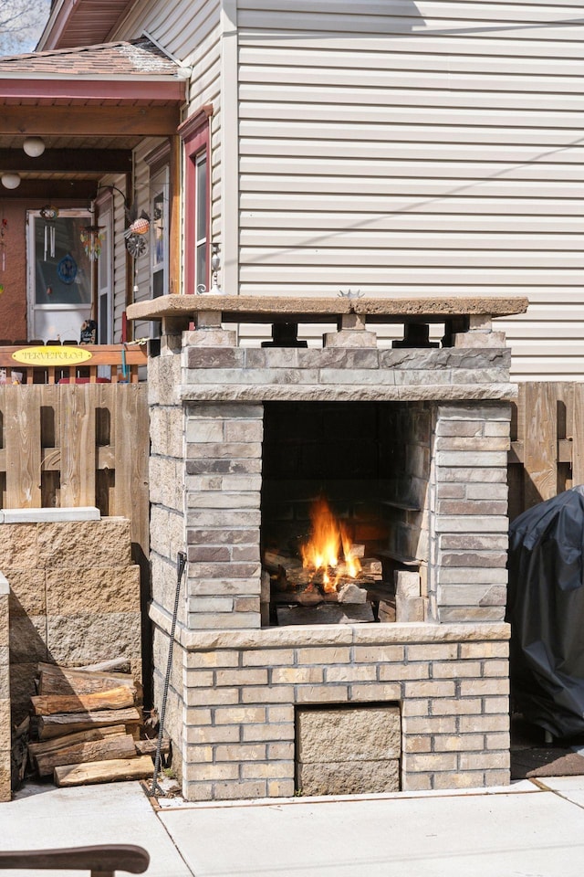 details with a lit fireplace