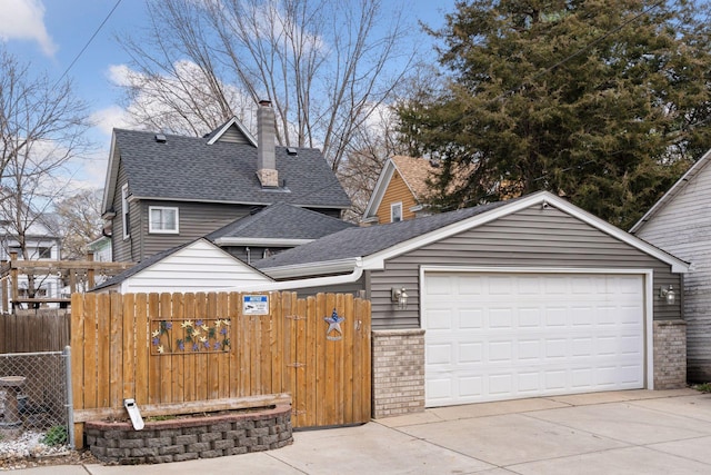 view of front of property with a garage, fence, roof with shingles, a chimney, and brick siding