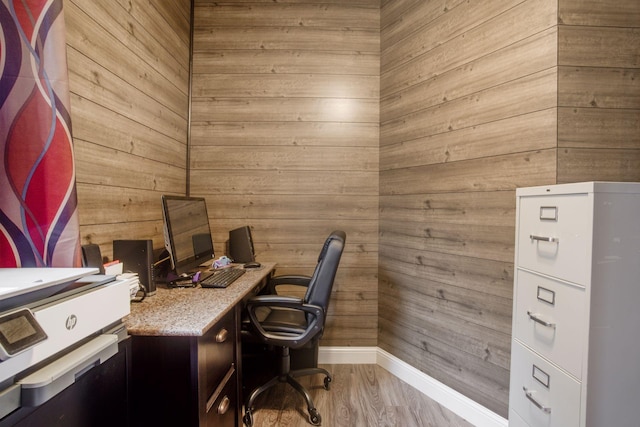 office area featuring baseboards and wood finished floors