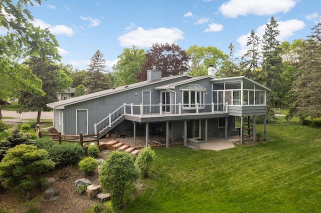 5410 Creek View Ln, Edina, MN 55439 - back of property featuring a sunroom, a chimney, a patio area, and a yard