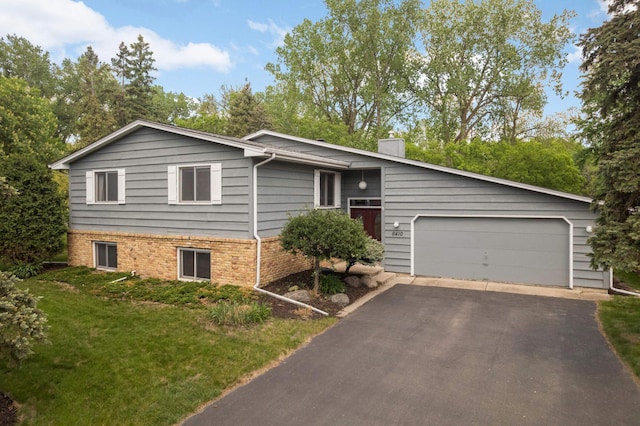 5410 Creek View Ln, Edina, MN 55439 - view of front facade featuring an attached garage, asphalt driveway, a front lawn, and brick siding