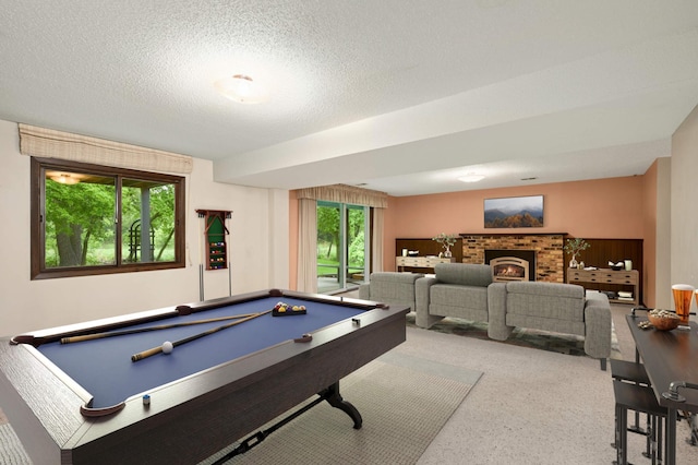 5410 Creek View Ln, Edina, MN 55439 - game room featuring billiards table, a brick fireplace, carpet flooring, and a textured ceiling