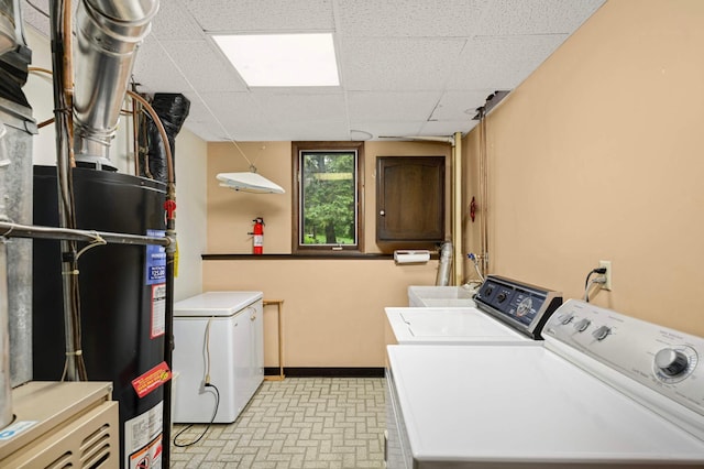 5410 Creek View Ln, Edina, MN 55439 - washroom featuring independent washer and dryer, water heater, baseboards, and brick patterned floors