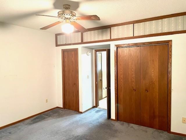 unfurnished bedroom with carpet flooring, a ceiling fan, baseboards, and a closet