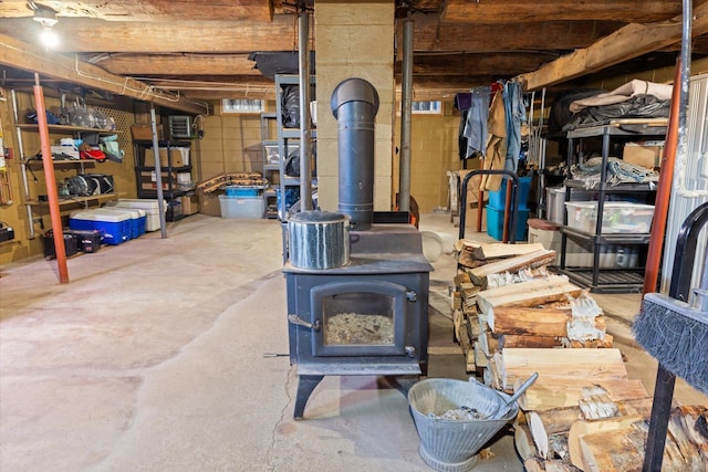 unfinished below grade area with a wood stove