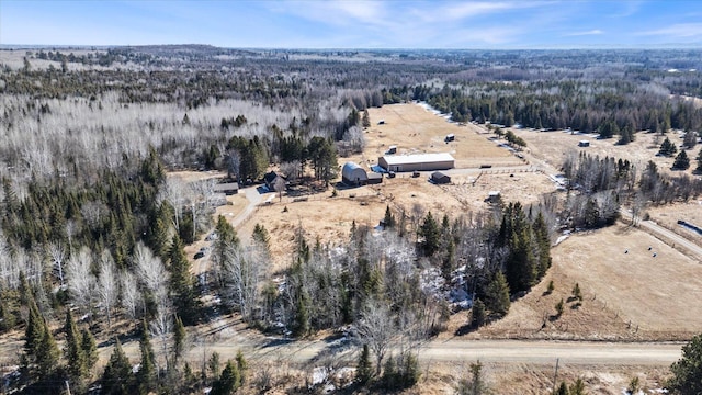 birds eye view of property with a wooded view