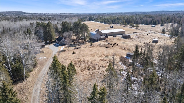 aerial view with a rural view and a wooded view