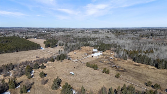 aerial view featuring a rural view and a wooded view