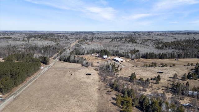 bird's eye view featuring a forest view and a rural view