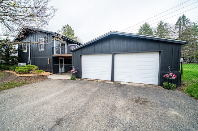 1474 Aldrich Ct, Faribault, MN 55021 - view of front facade with board and batten siding, an outbuilding, and fence