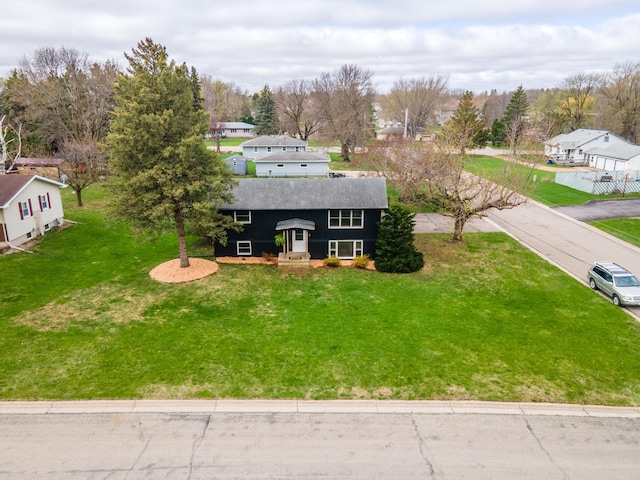 1474 Aldrich Ct, Faribault, MN 55021 - view of front of house with a shingled roof, a residential view, and a front yard