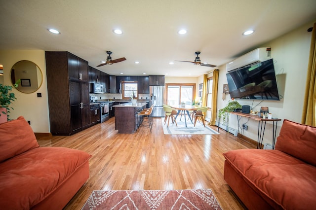 1474 Aldrich Ct, Faribault, MN 55021 - living area featuring a ceiling fan, recessed lighting, and an AC wall unit