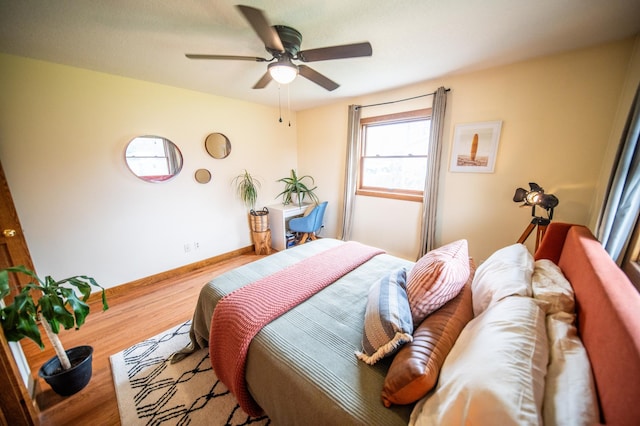 1474 Aldrich Ct, Faribault, MN 55021 - bedroom featuring wood finished floors, baseboards, and ceiling fan