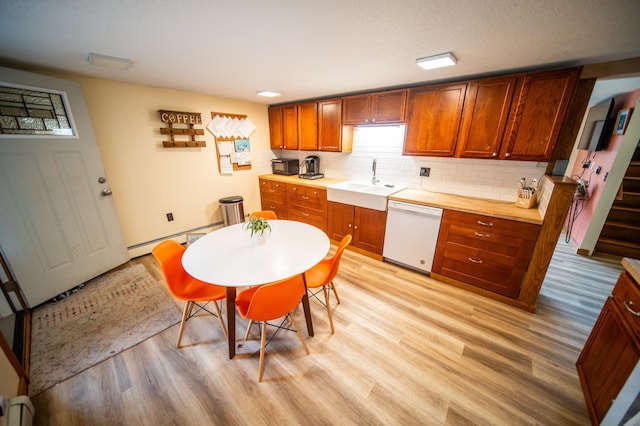 1474 Aldrich Ct, Faribault, MN 55021 - kitchen with dishwasher, a baseboard heating unit, a sink, light wood-style floors, and tasteful backsplash