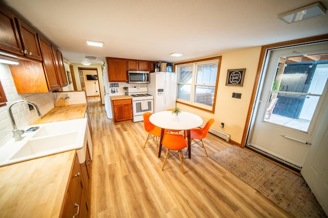 1474 Aldrich Ct, Faribault, MN 55021 - dining area with light wood-type flooring and a baseboard radiator