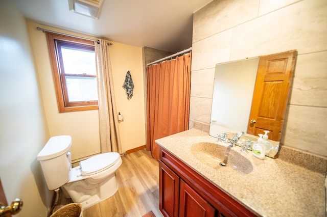 1474 Aldrich Ct, Faribault, MN 55021 - bathroom featuring toilet, curtained shower, vanity, and wood finished floors