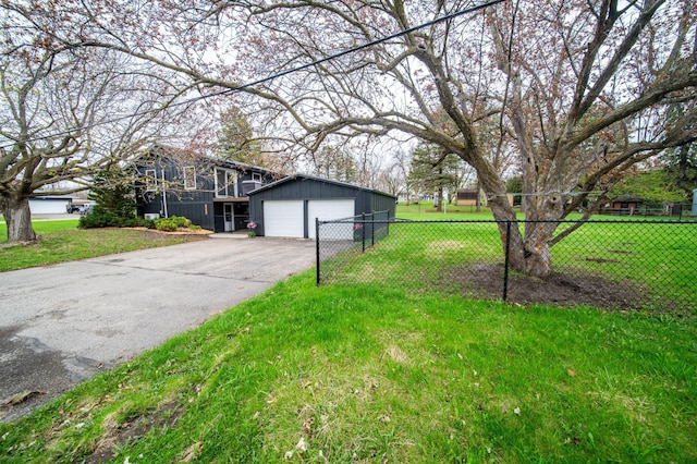 1474 Aldrich Ct, Faribault, MN 55021 - view of property exterior with a lawn, fence, and a detached garage
