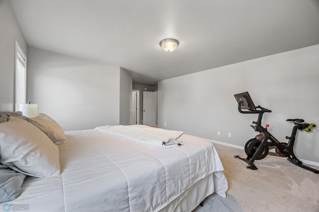 carpeted bedroom featuring baseboards