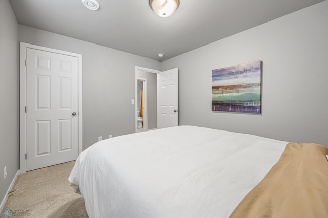 bedroom featuring carpet floors and baseboards