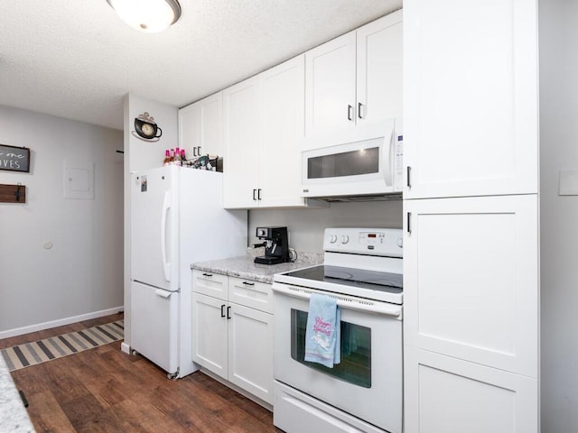 4001 Heritage Hills Dr Unit 105, Bloomington, MN 55437 - kitchen with a textured ceiling, white appliances, white cabinets, baseboards, and dark wood-style floors
