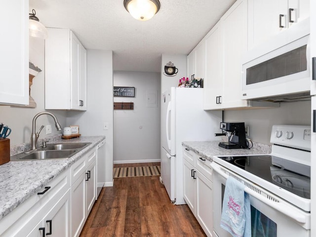 4001 Heritage Hills Dr Unit 105, Bloomington, MN 55437 - kitchen featuring dark wood-style flooring, a sink, white appliances, baseboards, and white cabinetry