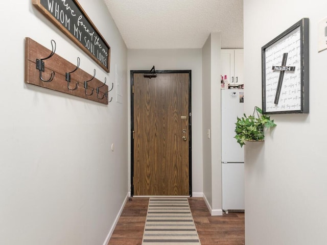 4001 Heritage Hills Dr Unit 105, Bloomington, MN 55437 - doorway featuring wood finished floors, a textured ceiling, and baseboards