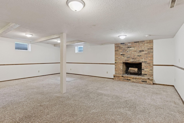 13982 Mount Ter, Minnetonka, MN 55345 - below grade area with a textured ceiling, carpet flooring, a fireplace, baseboards, and plenty of natural light