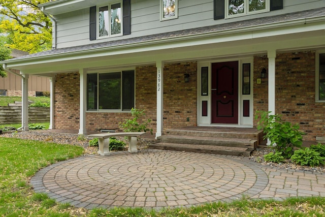 13982 Mount Ter, Minnetonka, MN 55345 - doorway to property featuring brick siding and covered porch