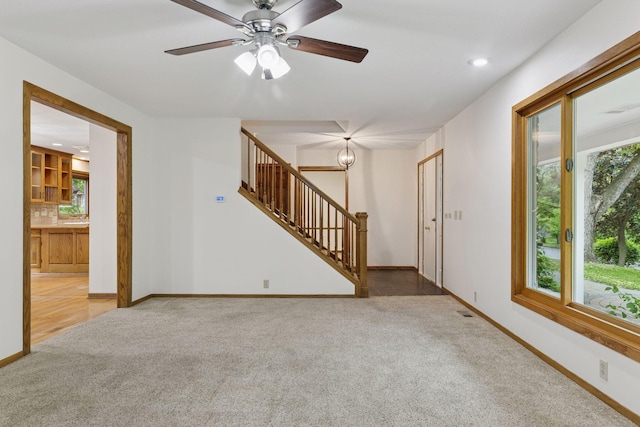 13982 Mount Ter, Minnetonka, MN 55345 - unfurnished living room with carpet floors, plenty of natural light, stairway, baseboards, and recessed lighting