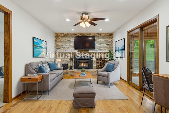 13982 Mount Ter, Minnetonka, MN 55345 - living area with a ceiling fan, light wood-style flooring, a brick fireplace, and baseboards