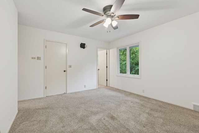 13982 Mount Ter, Minnetonka, MN 55345 - spare room with carpet, a ceiling fan, and baseboards