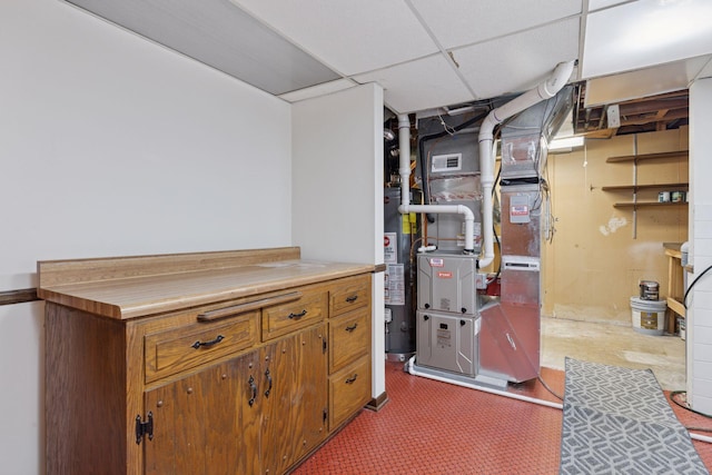 13982 Mount Ter, Minnetonka, MN 55345 - finished below grade area featuring water heater, heating unit, and a paneled ceiling
