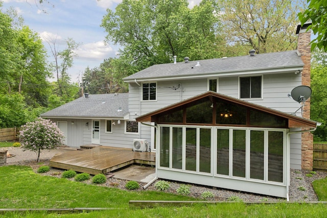 13982 Mount Ter, Minnetonka, MN 55345 - back of property featuring a sunroom, a wooden deck, a chimney, ac unit, and roof with shingles