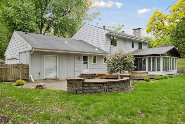 13982 Mount Ter, Minnetonka, MN 55345 - back of property featuring a sunroom, a chimney, a patio area, and roof with shingles